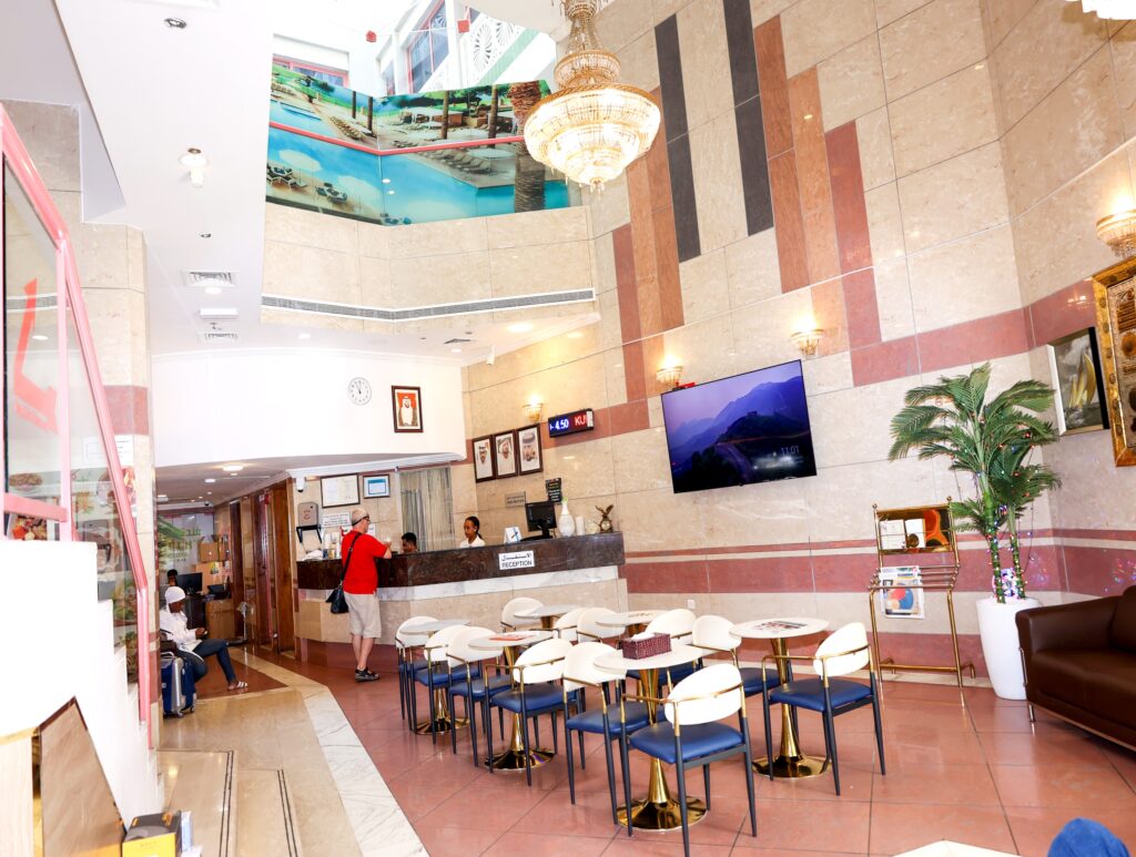 a hotel lobby with a counter and chairs